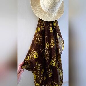 Sheer scarf. Brown with yellow skull print.